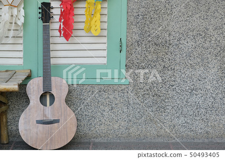 Guitar in room wall background Guitar in room wall background 50493405