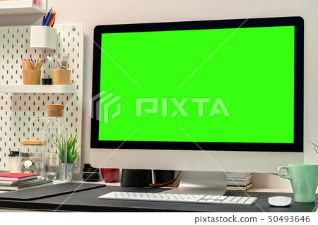 Loft workspace with green screen desktop computer Loft workspace with green screen desktop computer 50493646