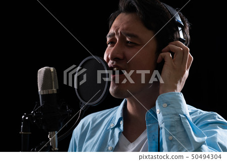 Man doing the recording Man doing the recording 50494304