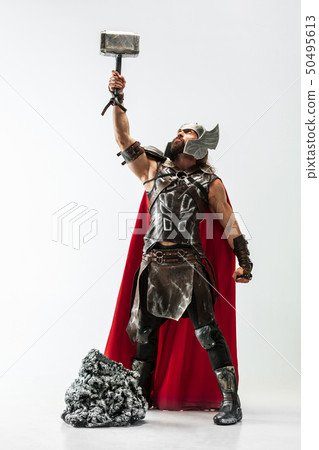 Man in cosplaying Thor isolated on white studio background Man in cosplaying Thor isolated on white studio background 50495613