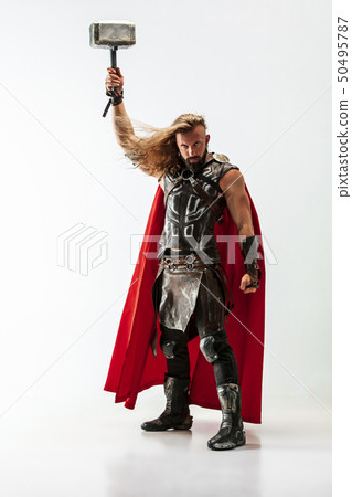 Man in cosplaying Thor isolated on white studio background 50495787