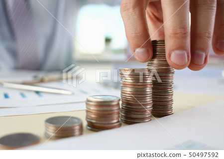 Hand businessman putting pin money 50497592