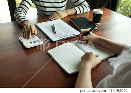 Woman talking with colleague about new startup. Woman talking with colleague about new startup. 50498601