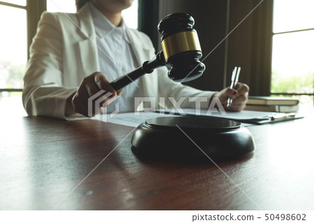 Lawyer working on the table in office. 50498602
