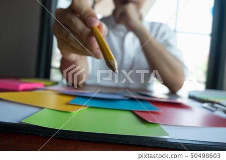 Graphic designer choose colors bands samples. 50498603