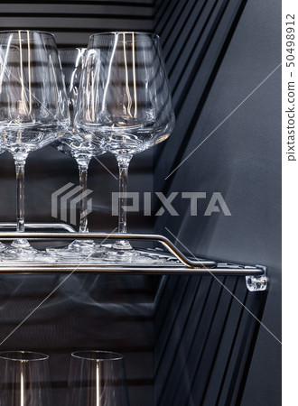 Brandy glasses and whiskey glasses on the shelf. Brandy glasses and whiskey glasses on the shelf. 50498912
