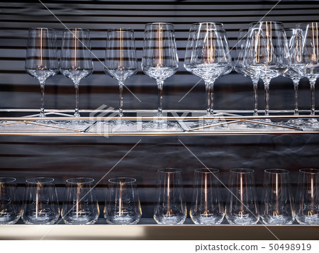 Brandy glasses and wineglasses on the shelf. Brandy glasses and wineglasses on the shelf. 50498919