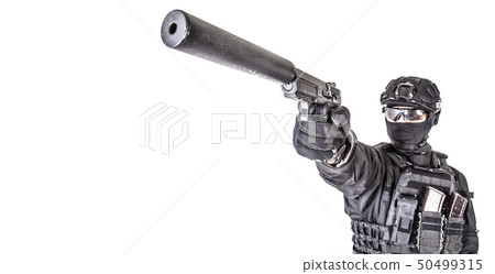 Studio portrait of SWAT officer aiming with pistol Studio portrait of SWAT officer aiming with pistol 50499315
