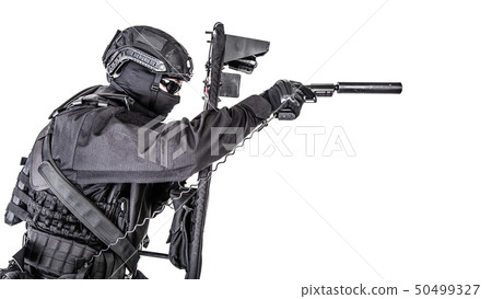 Studio shot of SWAT police special forces with pistol hiding