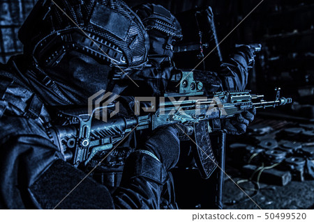 Police special reaction team attacking criminals in the dark Police special reaction team attacking criminals in the dark 50499520