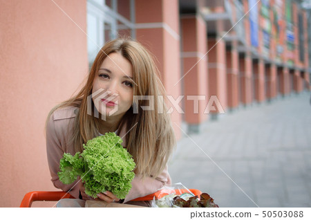 Portrait of young beauty woman eating salad 50503088