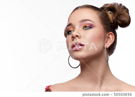 Adorable girl enjoying beautiful bright makeup Adorable girl enjoying beautiful bright makeup 50503656