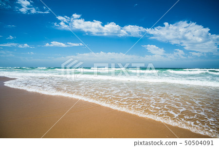 Yellow sand beach, sea and deep blue sky. Yellow sand beach, sea and deep blue sky. 50504091