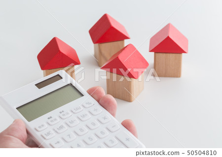 Hand holding a calculator Hand holding a calculator 50504810