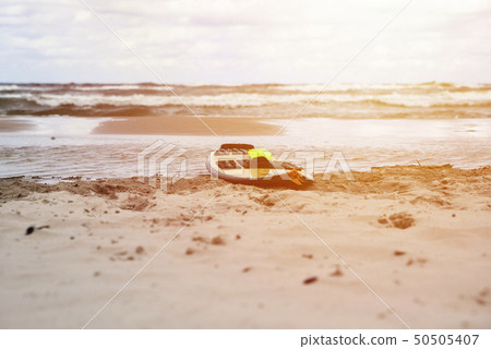 close up on kitesurfing board on the beach 50505407