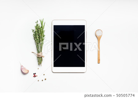 Empty tablet PC with greens herbs and spices Empty tablet PC with greens herbs and spices 50505774