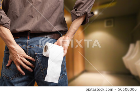 man holding toilet tissue roll in toilet 50506006