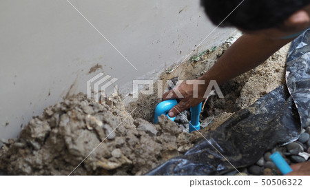 Fixing leaking water pipe underground the house Fixing leaking water pipe underground the house 50506322