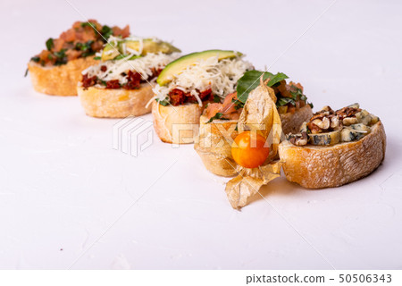 Delicious Italian antipasti bruschetta on white background. Macro. 50506343