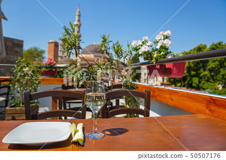 Plate and a glass of water on the table 50507176