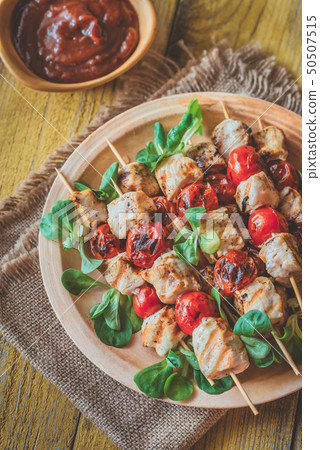 Grilled chicken skewers on the plate 50507515