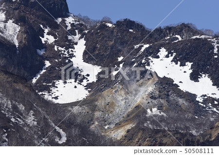Photographing the landscape of the remaining snow Eniwadake from the lakeside of Lake Shikotsu, Chitose, Japan 50508111