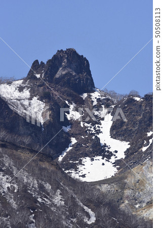 Photographing the landscape of the remaining snow Eniwadake from the lakeside of Lake Shikotsu, Chitose, Japan 50508113