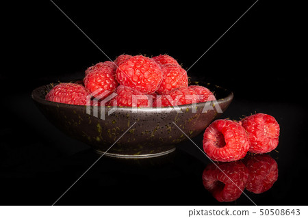 Fresh red raspberry isolated on black glass Fresh red raspberry isolated on black glass 50508643