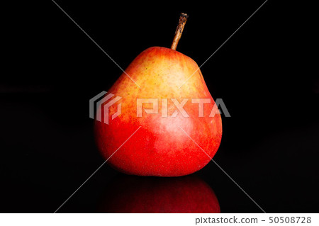 Fresh red pear isolated on black glass Fresh red pear isolated on black glass 50508728