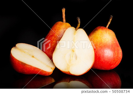 Fresh red pear isolated on black glass Fresh red pear isolated on black glass 50508734