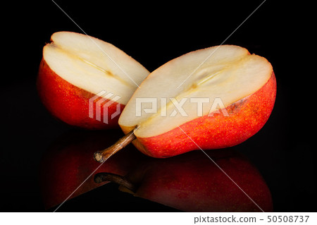 Fresh red pear isolated on black glass Fresh red pear isolated on black glass 50508737