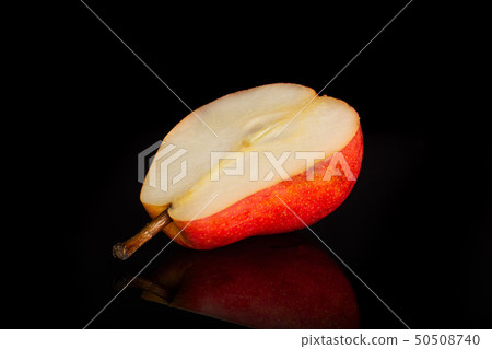 Fresh red pear isolated on black glass Fresh red pear isolated on black glass 50508740