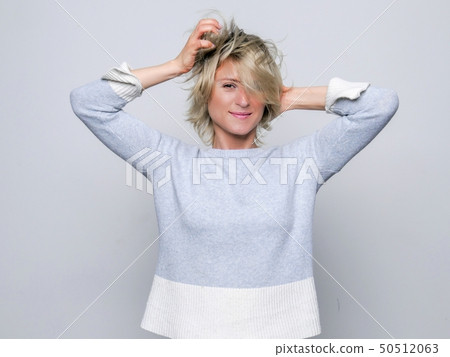 Woman flutters her hair Woman flutters her hair 50512063