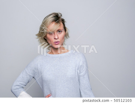 Sad blond Woman in studio. 50512103