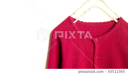 Close up of red cardigan shoulder and collar on white background Close up of red cardigan shoulder and collar on white background 50512365