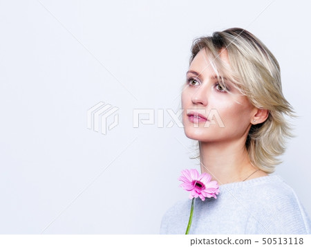 Woman with pink flower Woman with pink flower 50513118