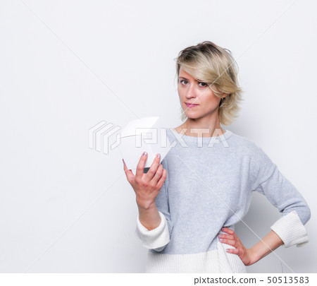 Small gift in the hands of a woman. 50513583