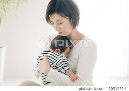 Baby sleeping in a mother's baby Infant child rearing child rearing Baby sleeping in a mother's baby Infant child rearing child rearing 50514534
