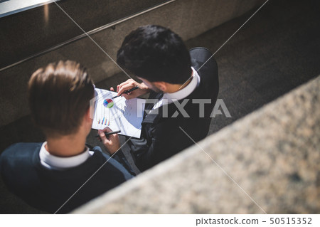Businessmen discussing about new project. Businessmen discussing about new project. 50515352