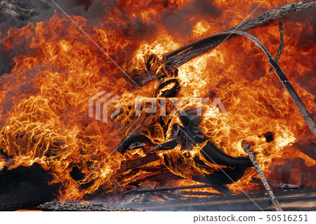 Burning cars wheels, strong flame of red fire 50516251