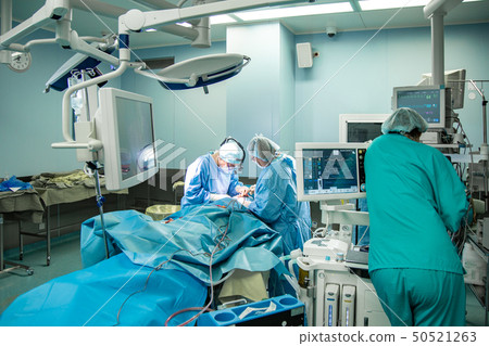 Operating room, surgeons perform an operation, a team of professional surgeons working in the 50521263