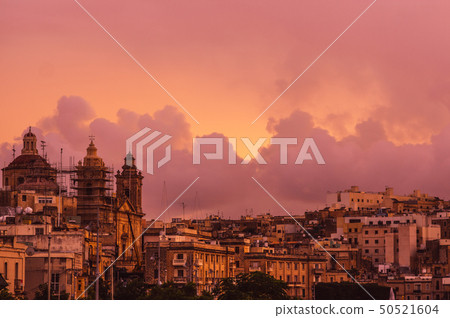 Pink evening in Cospicua and view to Immaculate Pink evening in Cospicua and view to Immaculate 50521604