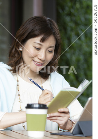 A woman working in a cafe 50526719