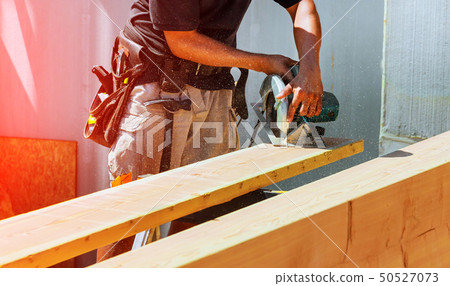 Circular Saw. Carpenter Using Circular Saw 50527073