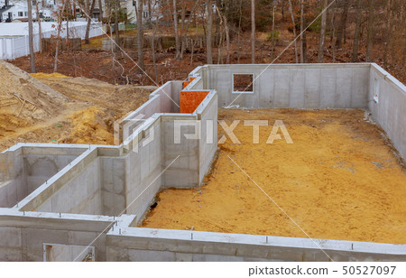 Under construction foundation new home with cement 50527097