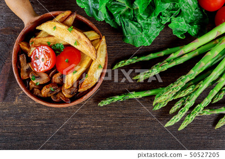 Grilled mushroom caps with fried potato Grilled mushroom caps with fried potato 50527205