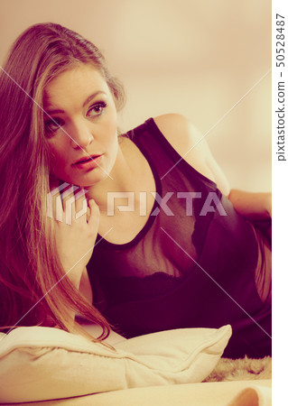 Girl lying on the bed. 50528487