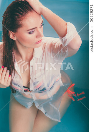 Sexy seductive woman in water. 50529271