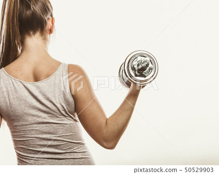 Strong woman lifting dumbbells weights. Fitness. Strong woman lifting dumbbells weights. Fitness. 50529903