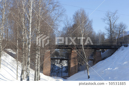 Old pedestrian bridge over the ravine in the city 50531885